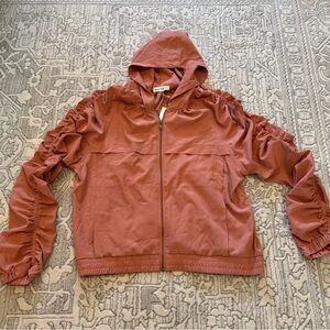 New In lightweight jacket with a hood